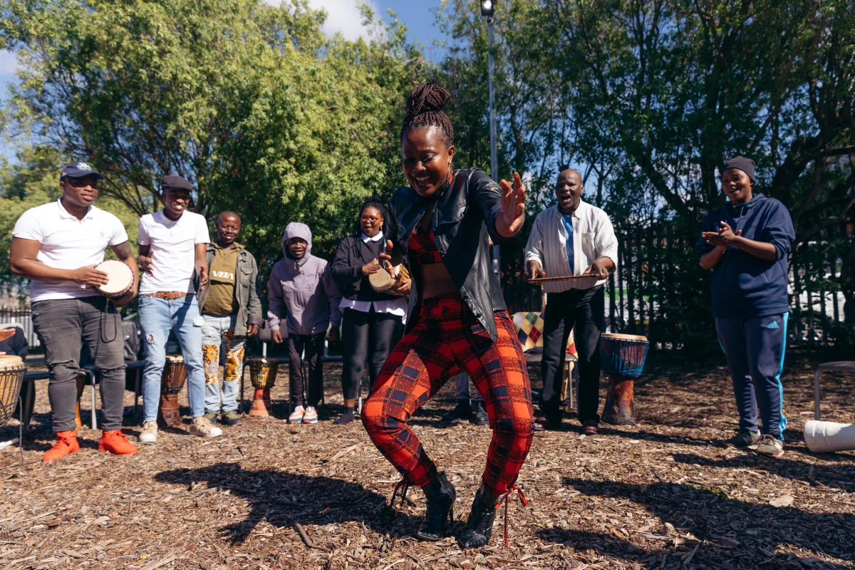 Drum circle and dancing outdoors in Cape Town